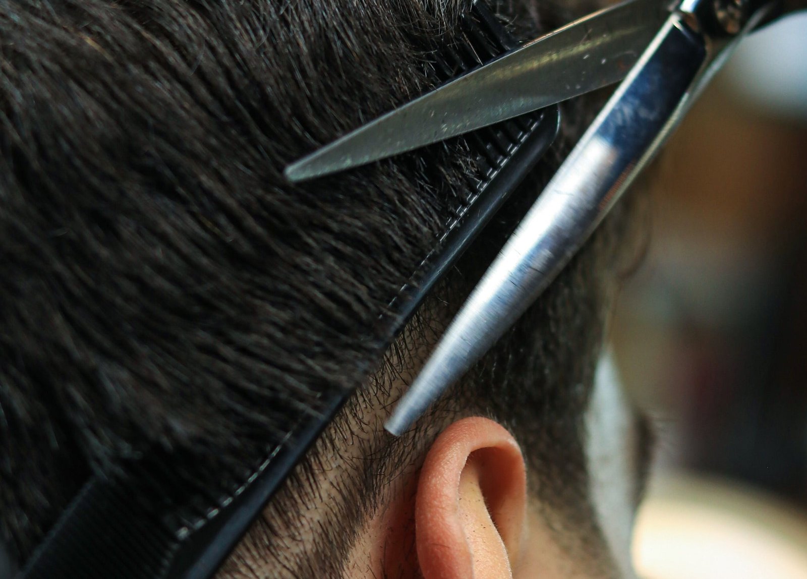 Close-up of scissors refining a haircut at Blackjack JBR